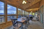 Living Room Features Leather Furniture, Wood Burning Fireplace, and Stunning Mountain Views